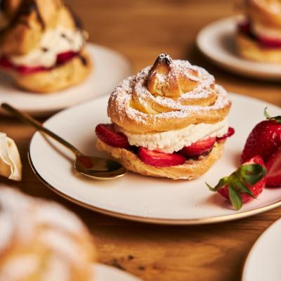 Closeup Shot Delicious Cream Puff With Strawberries Wooden Table Min
